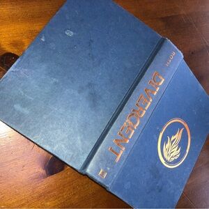 Divergent by Veronica Roth- a science fictions series for young and old. Used